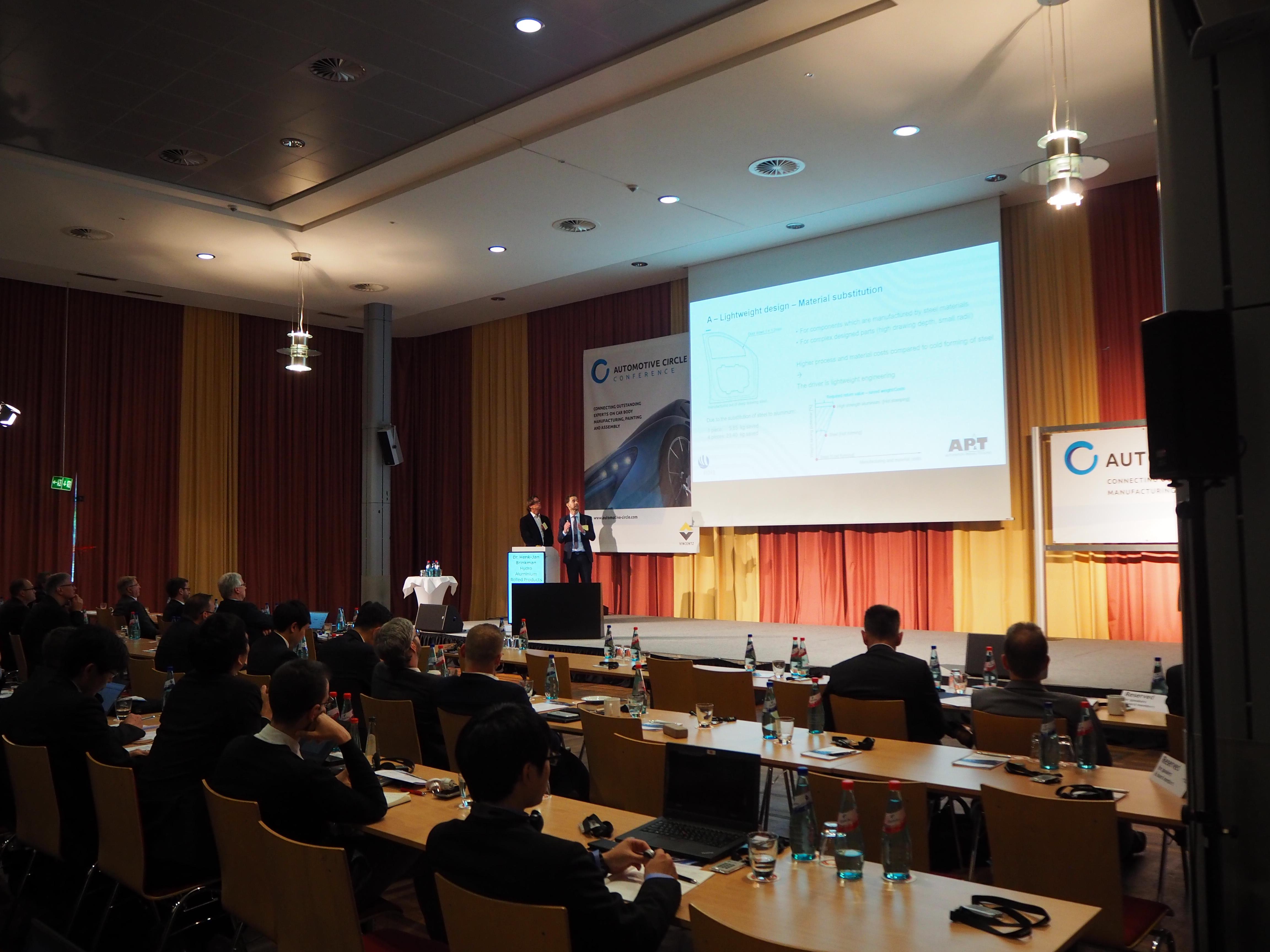Dr. Michael Machhammer from AP&T and Dr. Henk-Jan Brinkman from Hydro Aluminium presented how hot forming of high-strength aluminum enables new opportunities for manufacturing lightweight and high-strength car body parts. (Photograph: Automotive Circle).